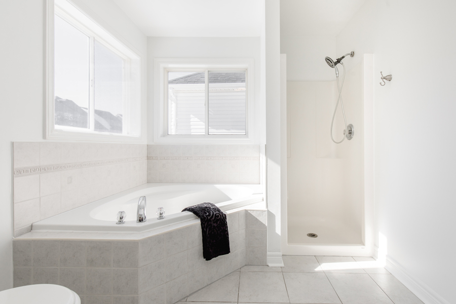 Modern Bathtub and Shower Installation on a Complete Home and Basement Renovation by Landshape